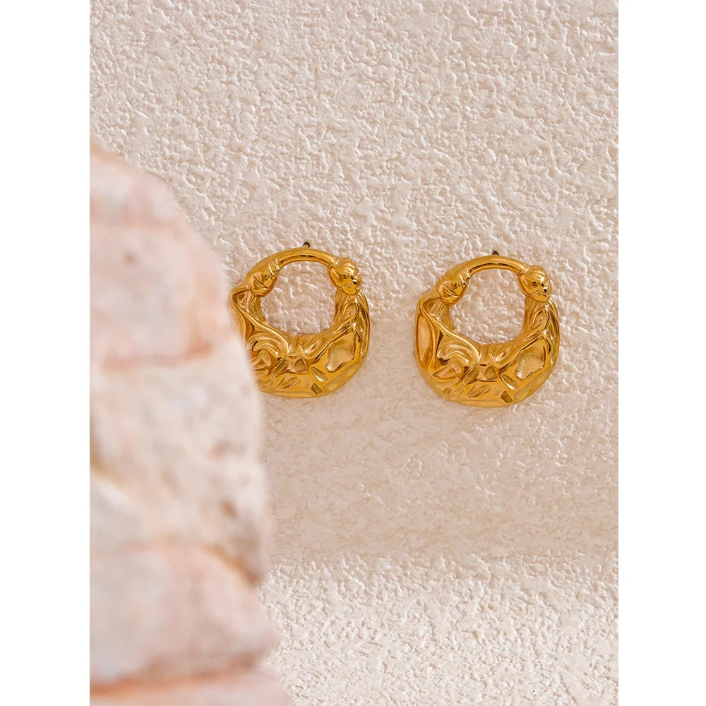 Elegant gold earrings captured as simple stud earrings