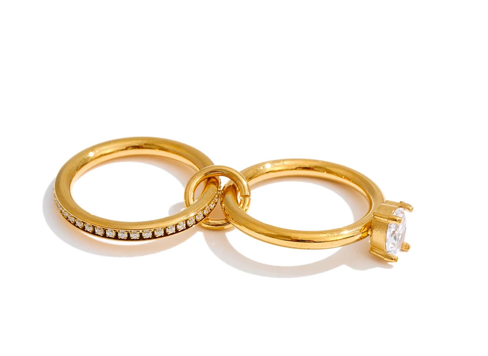 Warm gold of the ring reflecting shimmering gemstone light