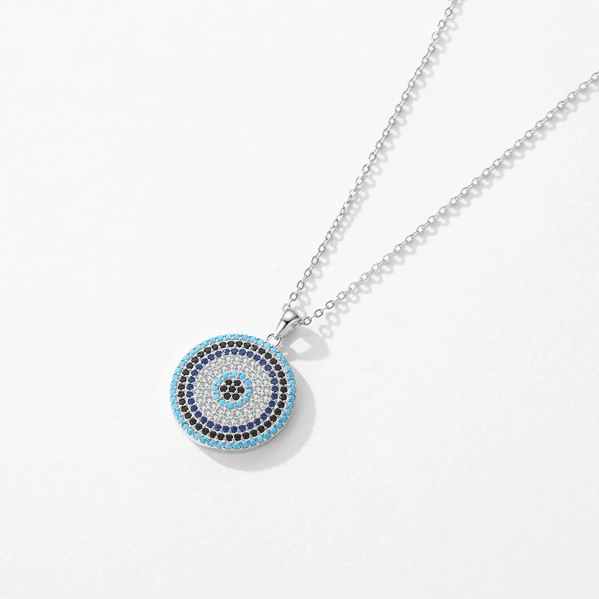 925 sterling silver chain necklace holding a turquoise pendant