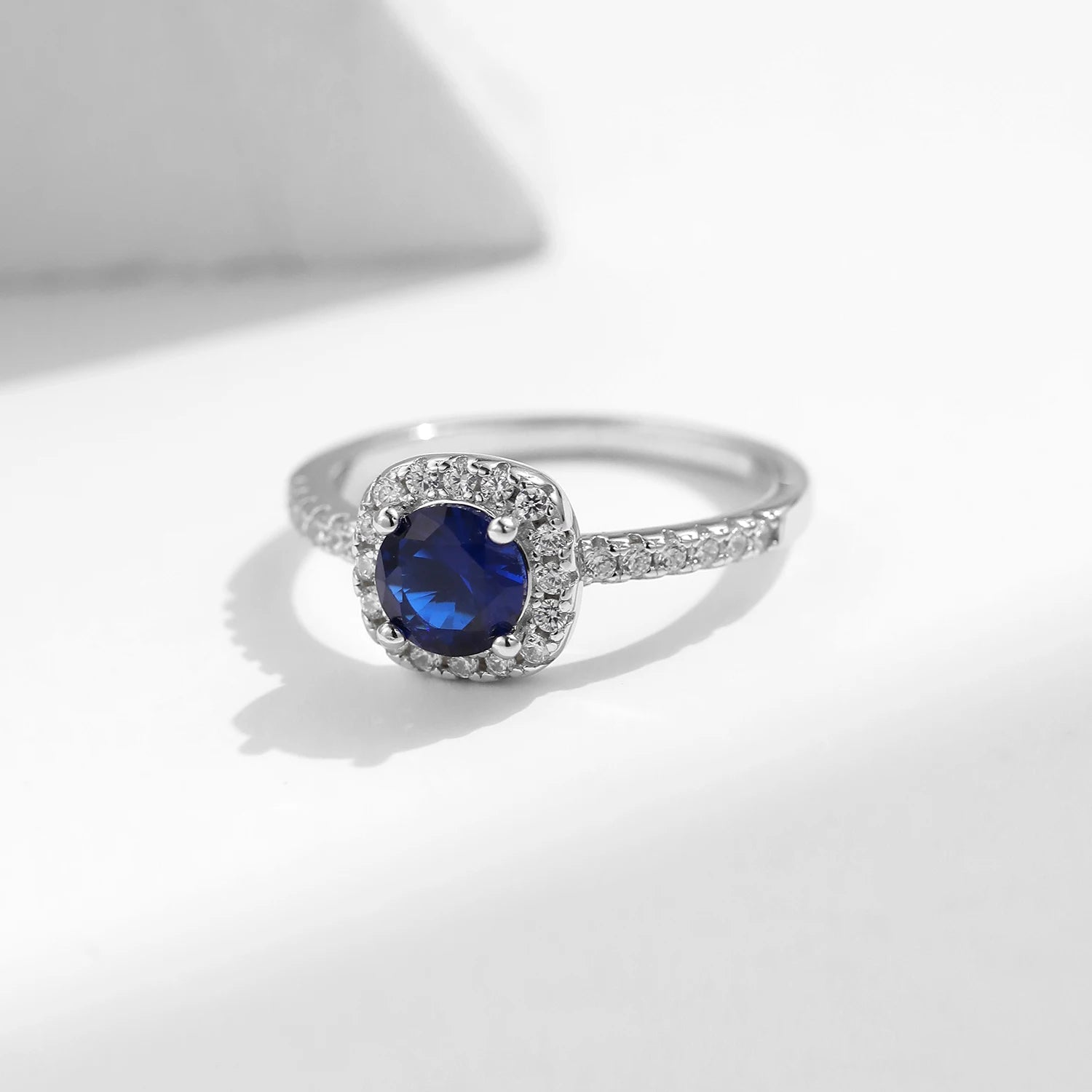 Blue zircon accent on a sterling silver ring with ring size from ring guidance