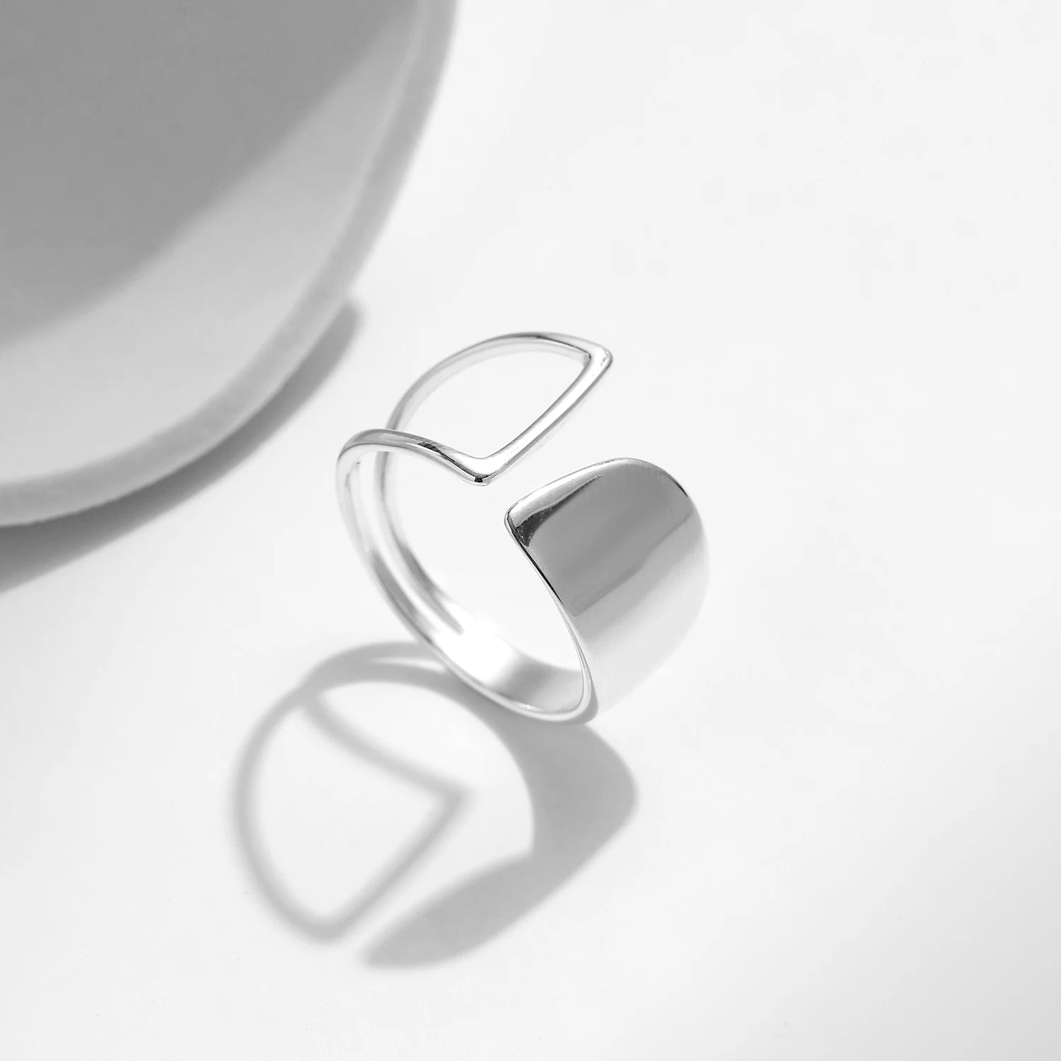 Sterling silver ring with sculptural open design and polished finish