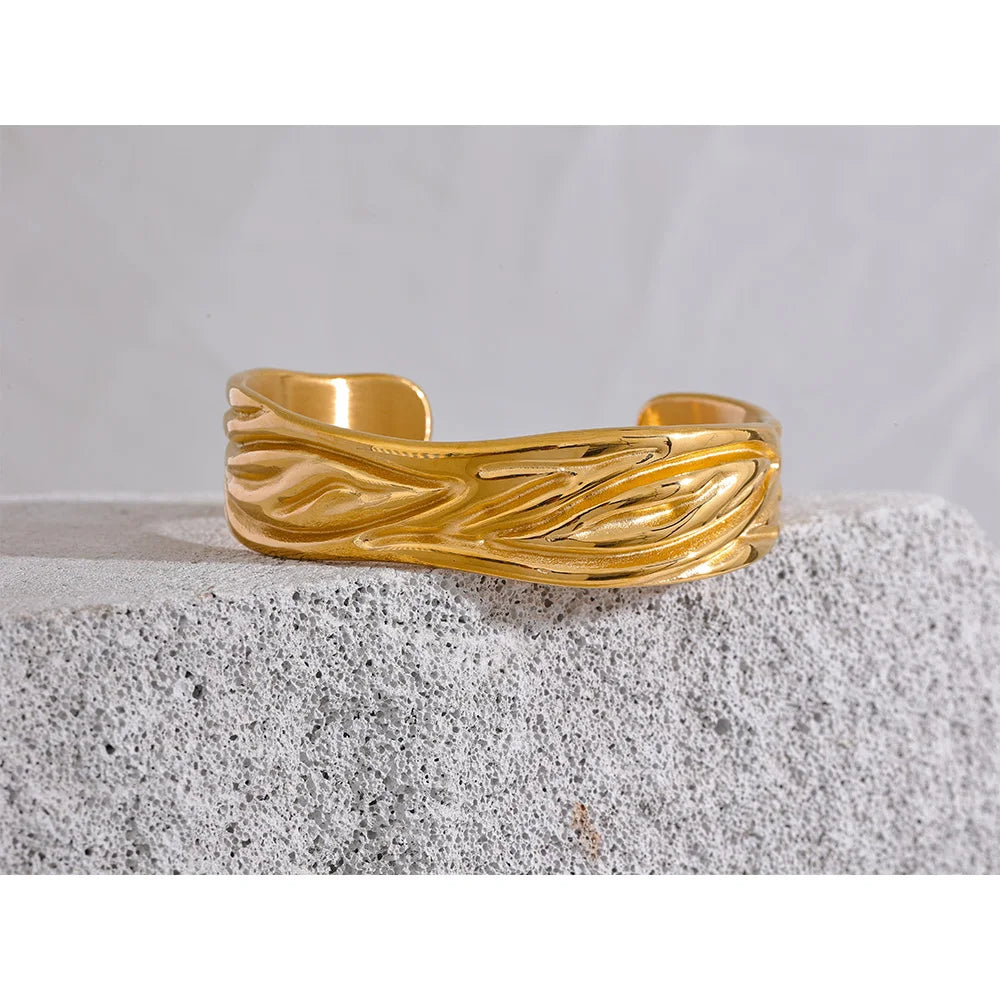 A gold bracelet layered in a bracelet for gold stack