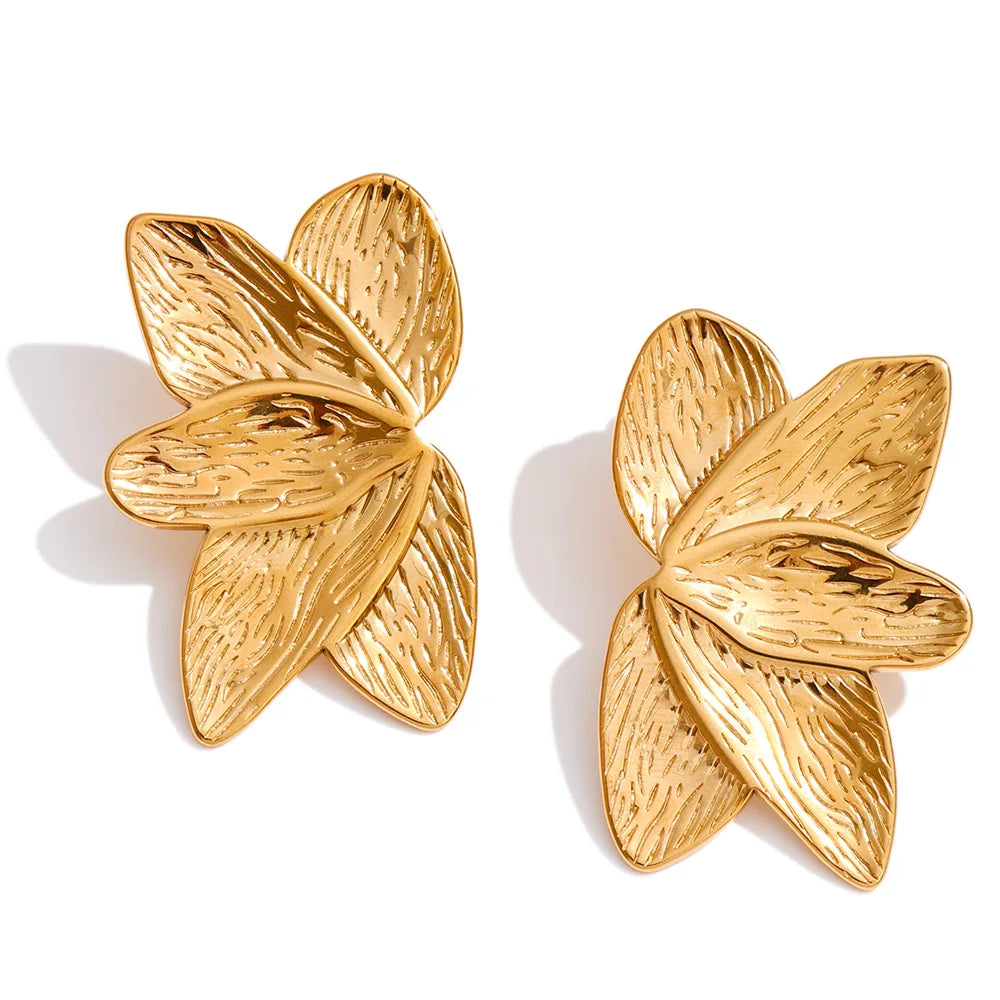 Refined gold earrings gold plated floral accessory close up