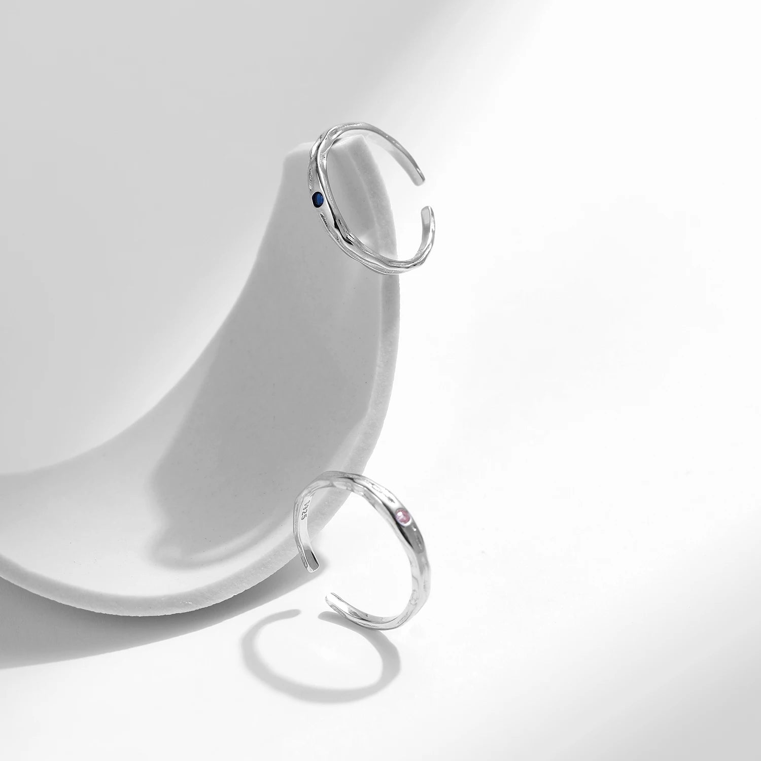 Sterling ring layered as a stackable ring beside another silver ring