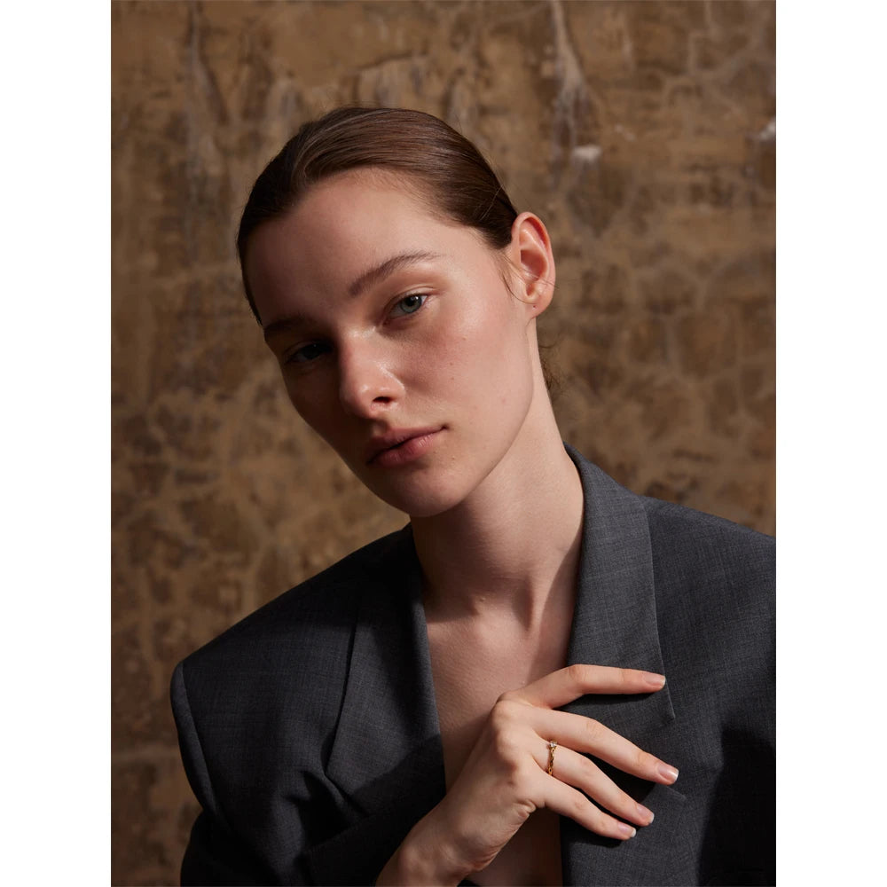 Ring with gold and cubic zirconia stone in stainless steel