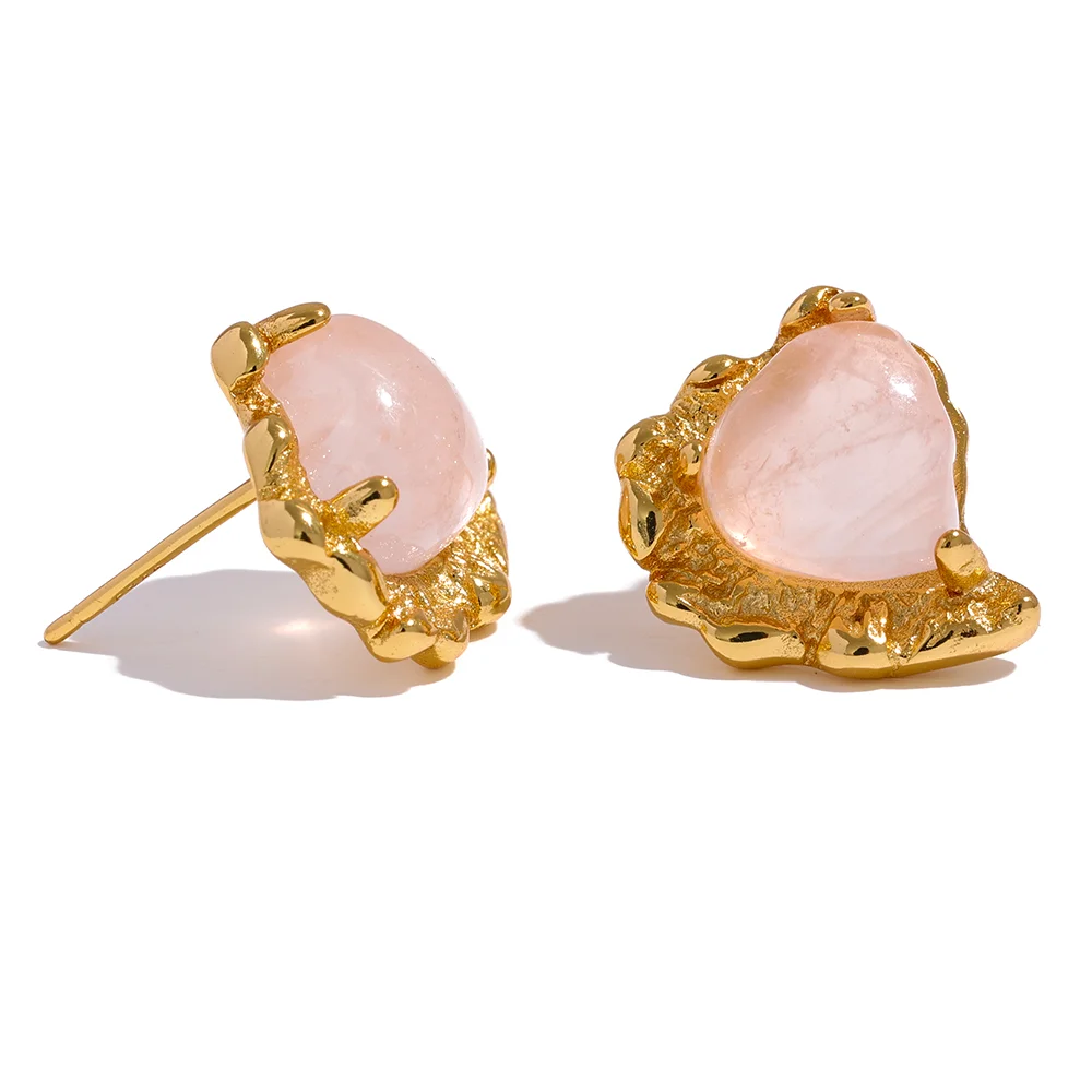 Rose quartz heart earrings shown as sterling silver earrings with soft glow