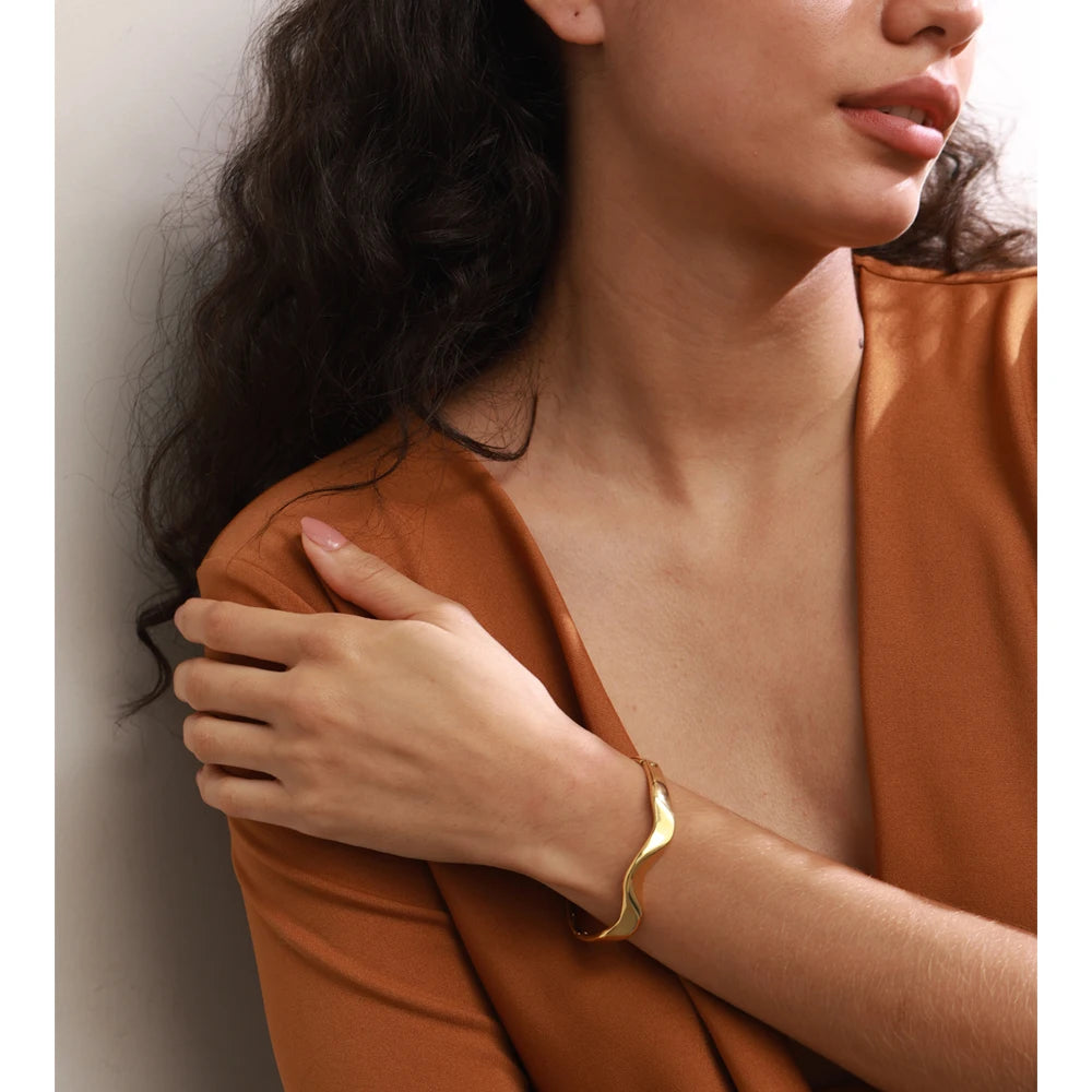 Close up of bracelet with gold irregular design