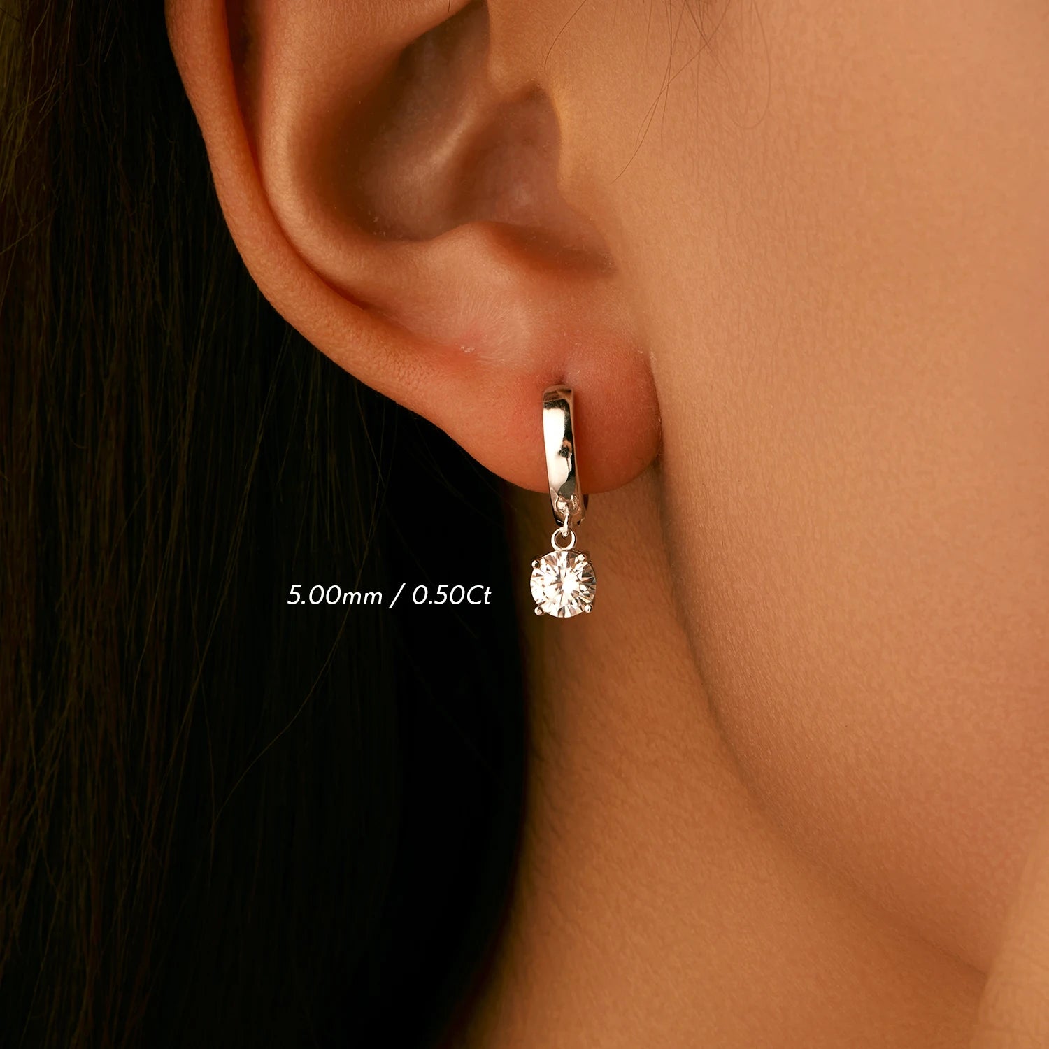Sterling silver earrings styled as silver hoop earrings with moissanite sparkle