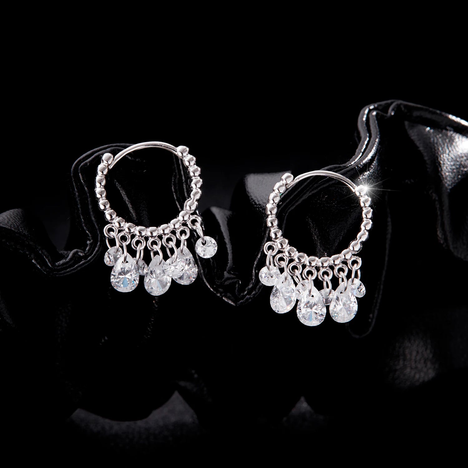 Studio shot of 925 sterling silver hoop earrings as luxury jewelry display