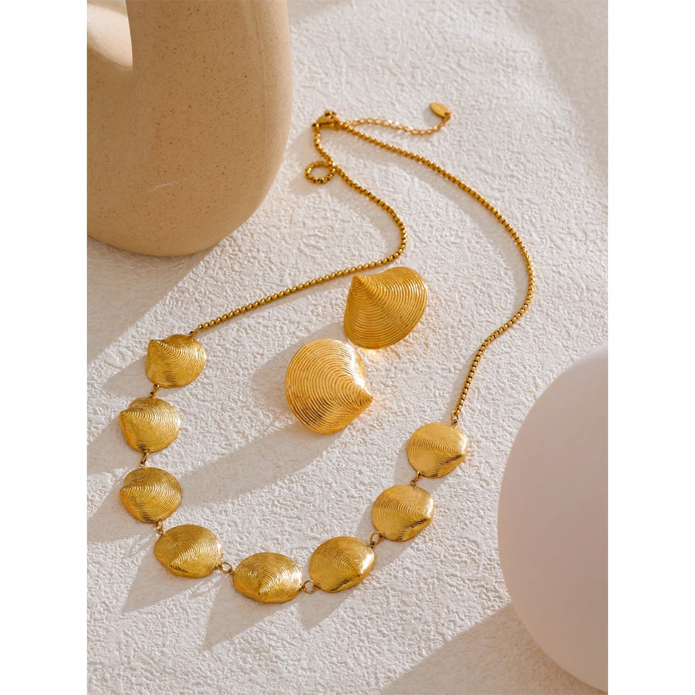 Polished gold jewelry finish for a timeless necklace and earrings set