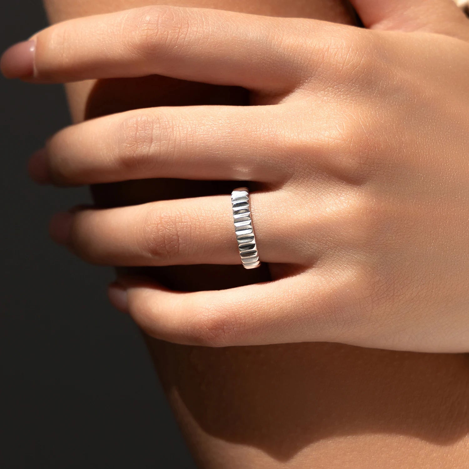 Close view of sterling silver ring showing classic silver ring contour