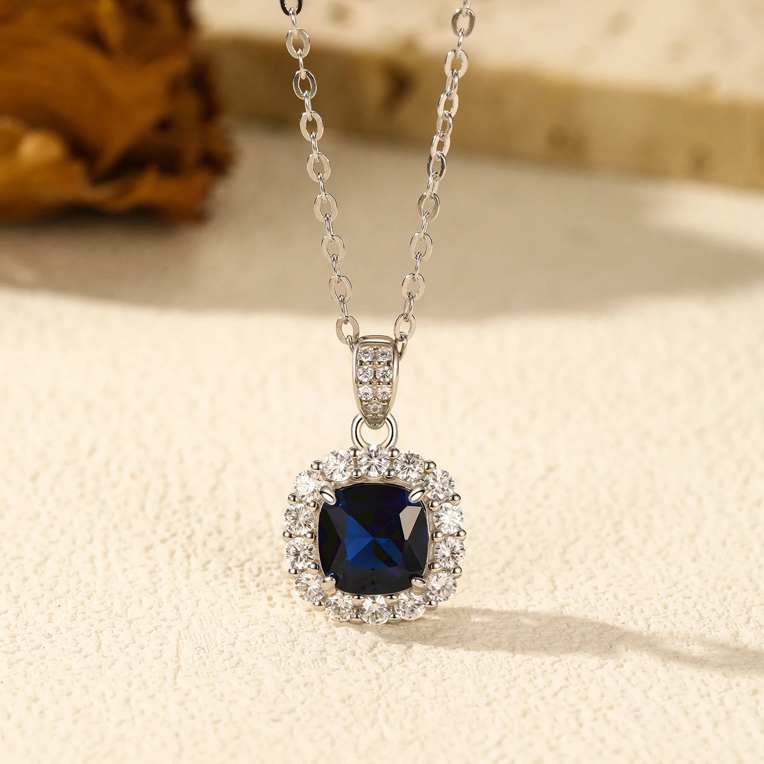 Close view of blue gemstone on a sterling silver necklace