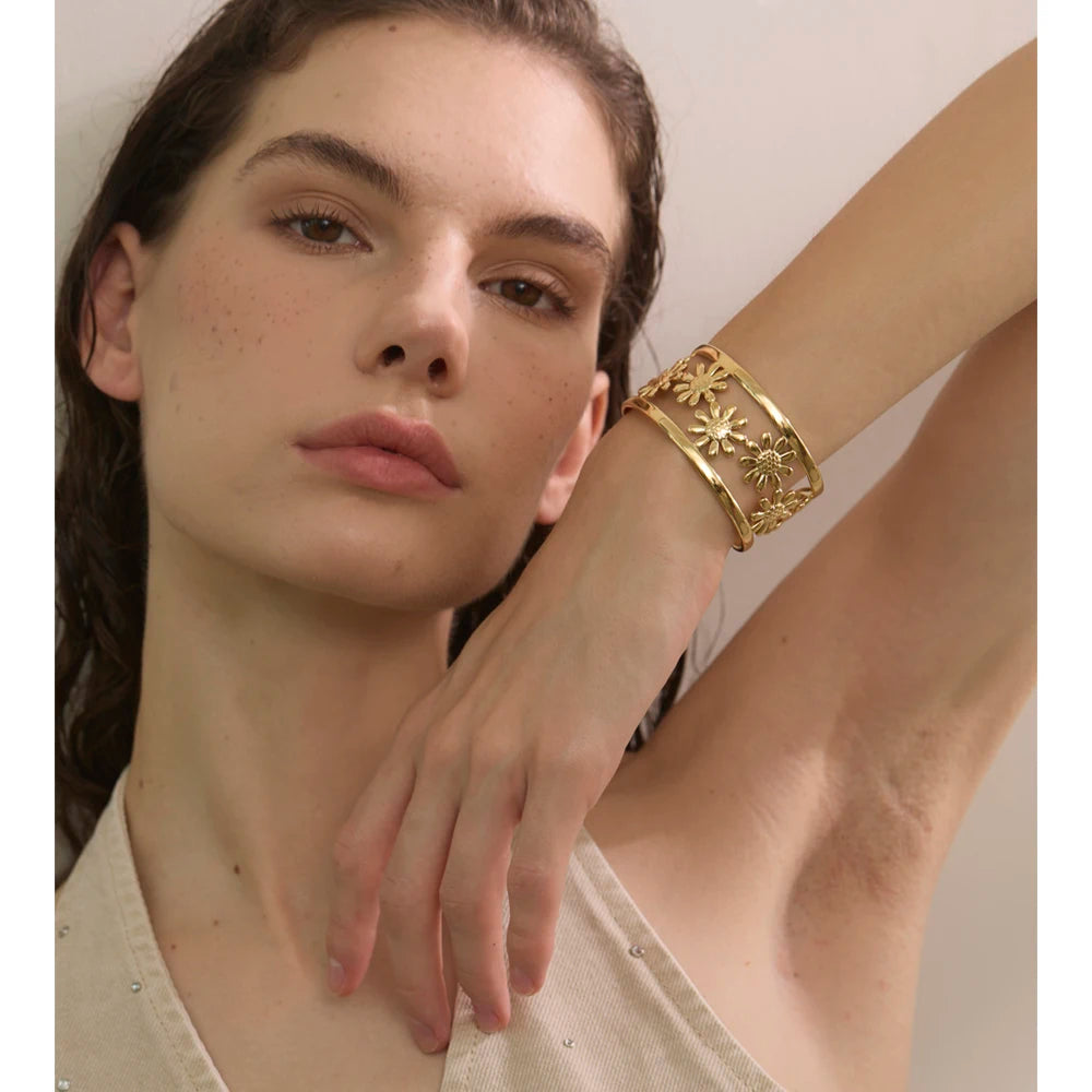 Matching flower ring and flower bracelet in polished gold