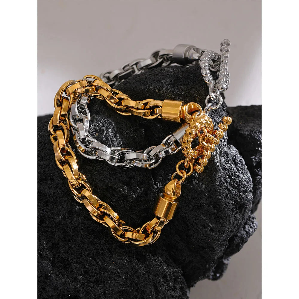 Chain bracelet detail highlighting smooth gold plated texture