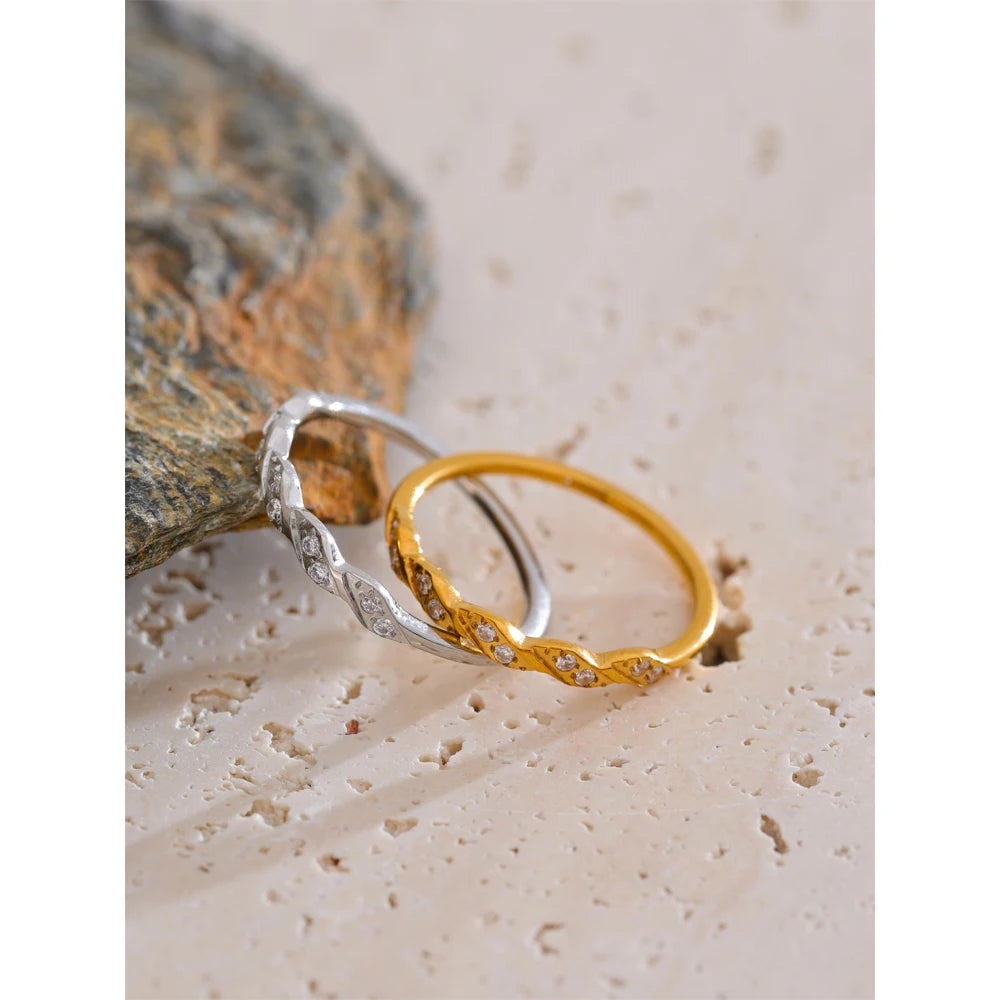 Minimal finger and ring styling with a ring in a finger wave silhouette