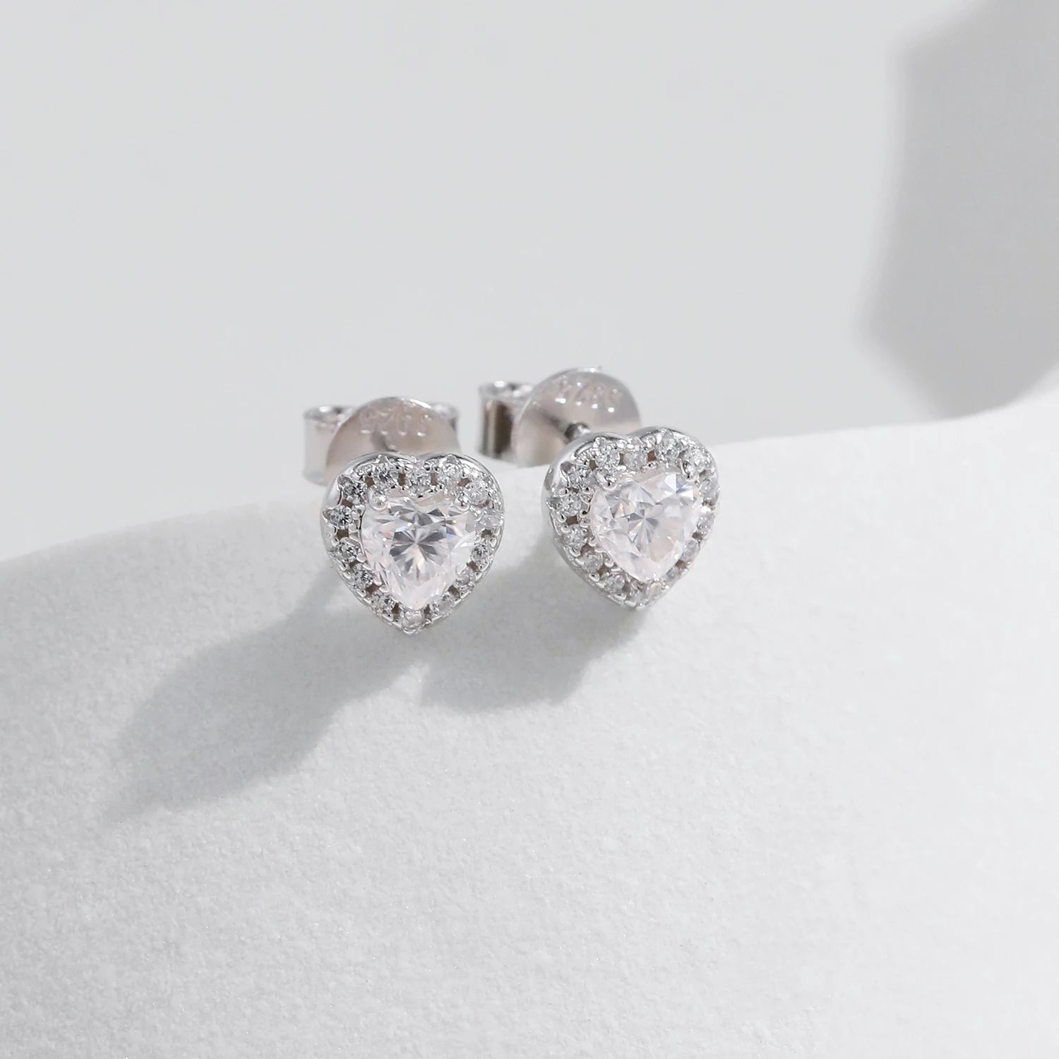 Soft light image of moissanite earrings styled within moissanite jewelry