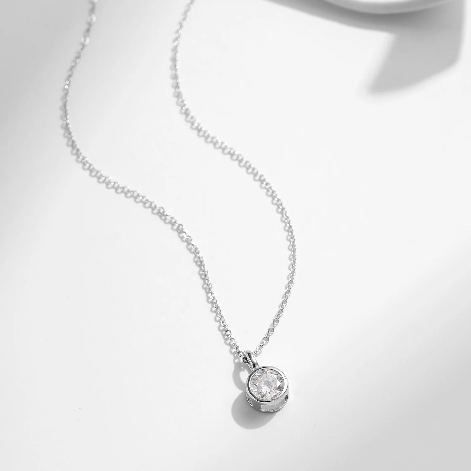 Long necklace look featuring a moissanite chain and pendant necklace