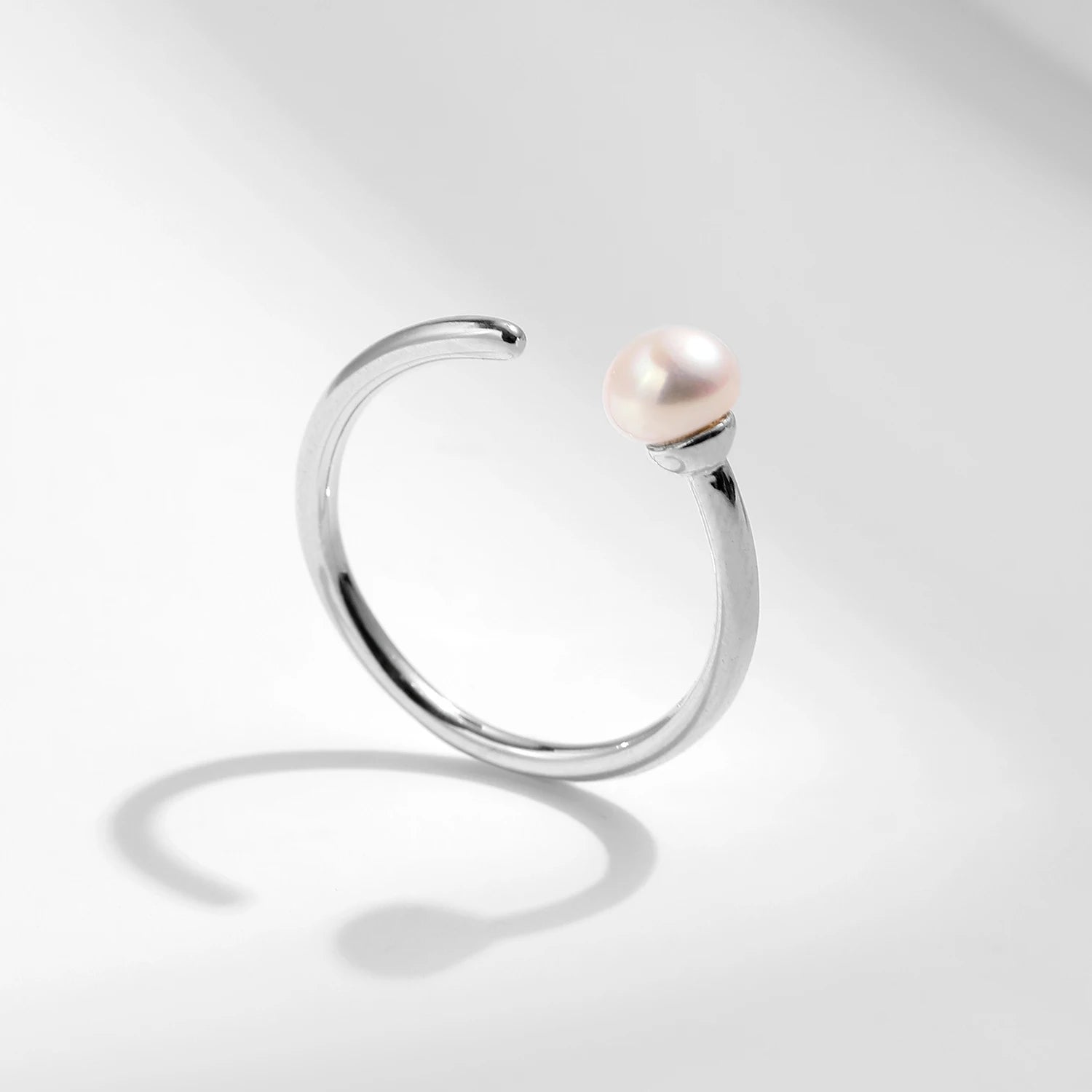 Elegant pearl ring crafted as a sterling silver ring with soft pe arl glow