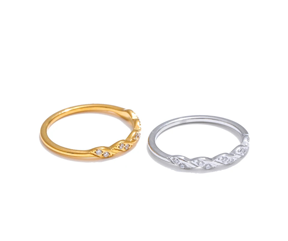 Lifestyle image pairing finger and ring stacks with a wave shape accent