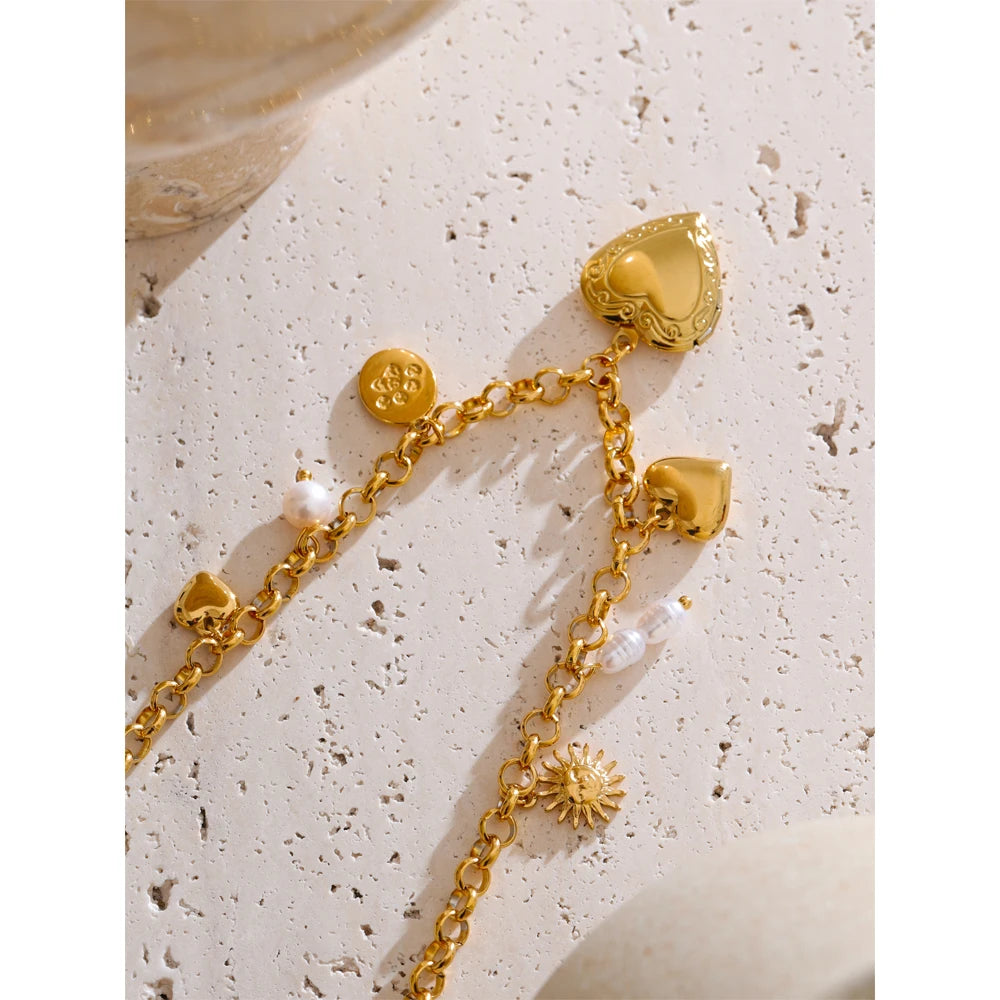 Chain detail showing pearl with necklace glow beside a gold bracelet