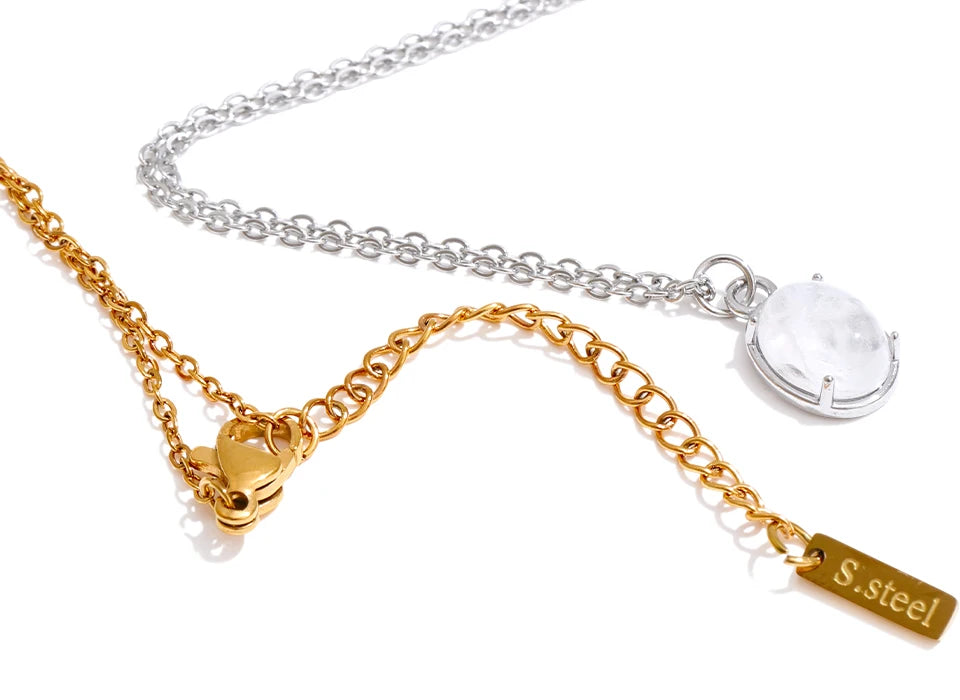 Oval pendant on a necklace crafted with natural stone detail