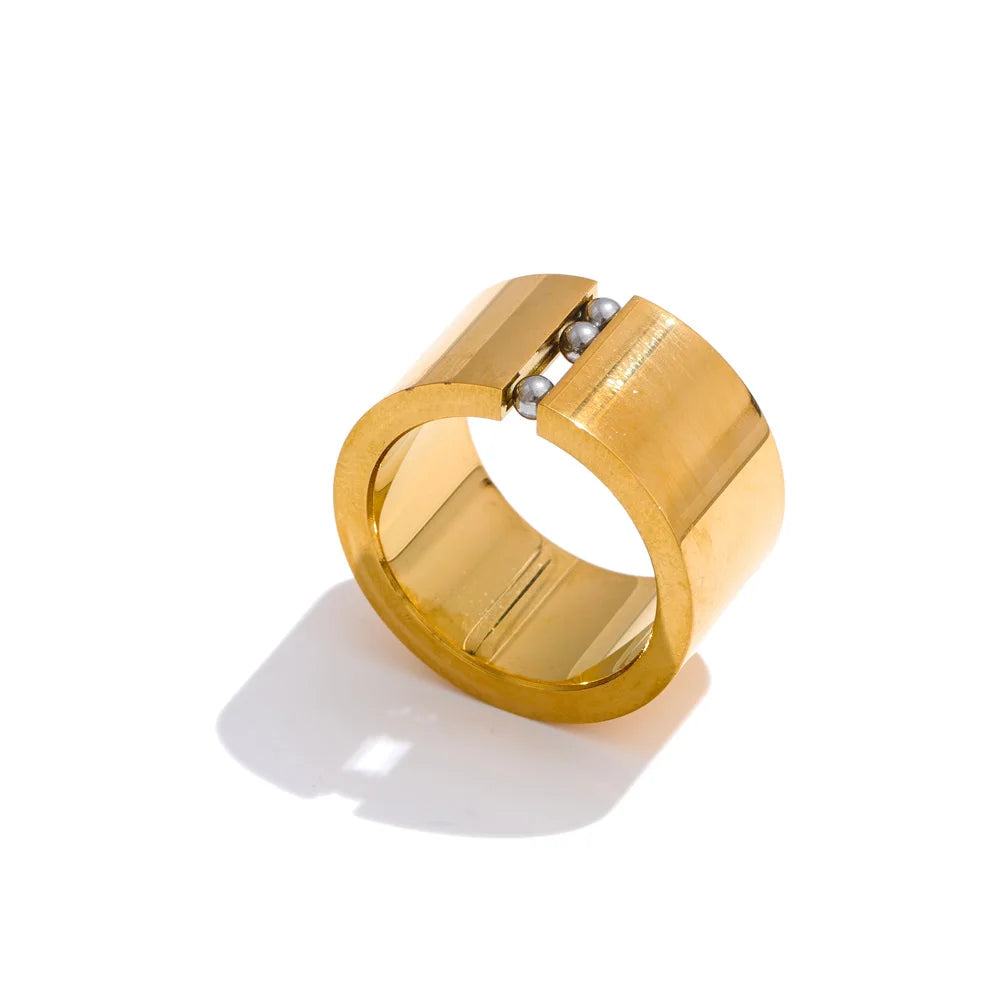 Gold plated jewelry band highlighting movable charm for subtle motion