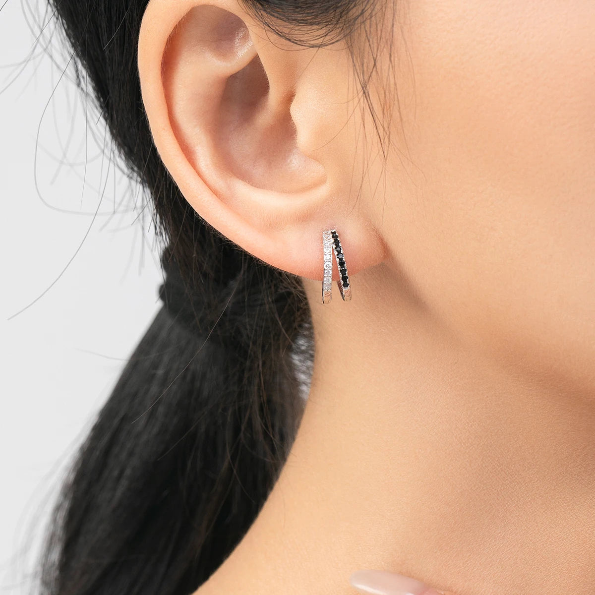 Zirconia detail on silver hoop earrings crafted in 925 sterling silver