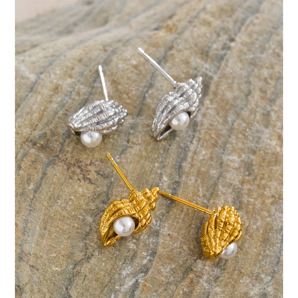 Modern ear rings with petite conch and pearl details