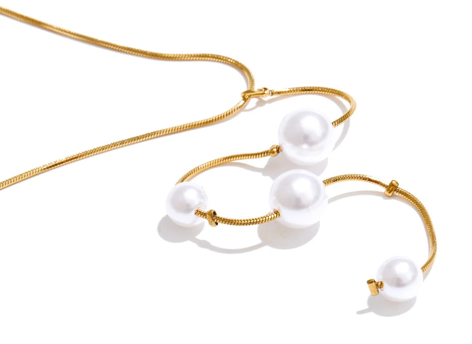 Pearl in necklace design arranged along a sleek chain drop