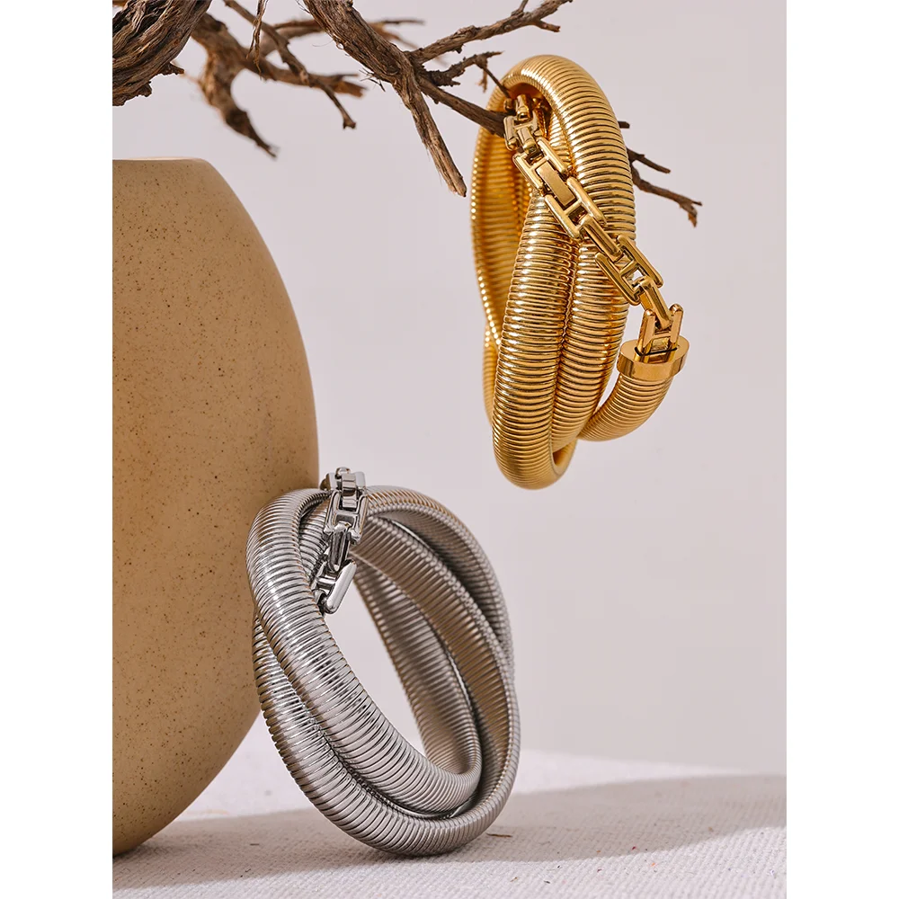 Close view of gold bangle showing bracelet gold bracelet detail