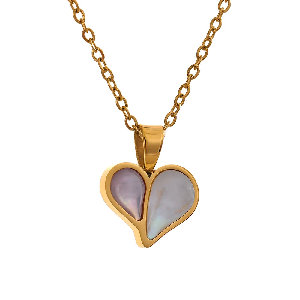 Gold heart pendant necklace with a delicate charm necklace look