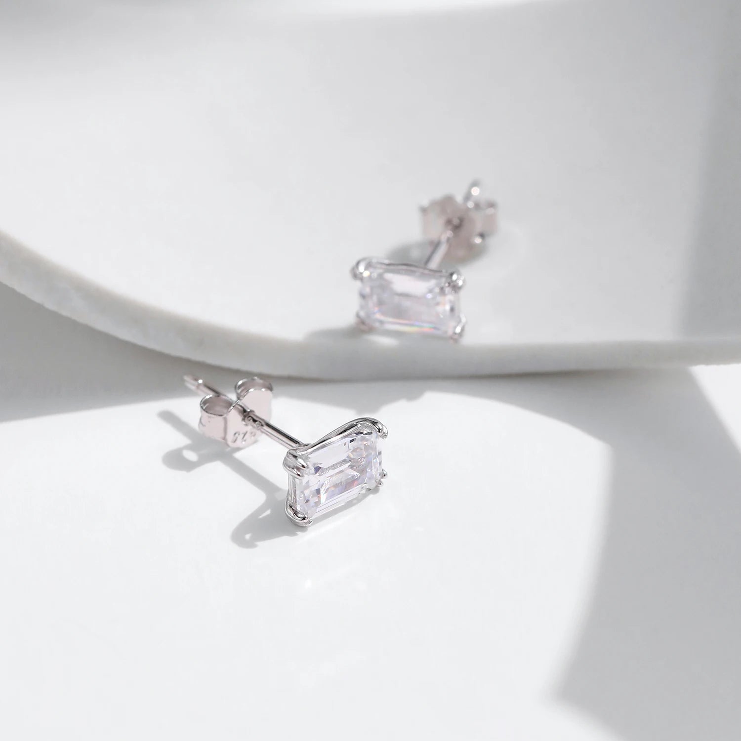 Close-up of emerald-cut stone in sterling silver setting