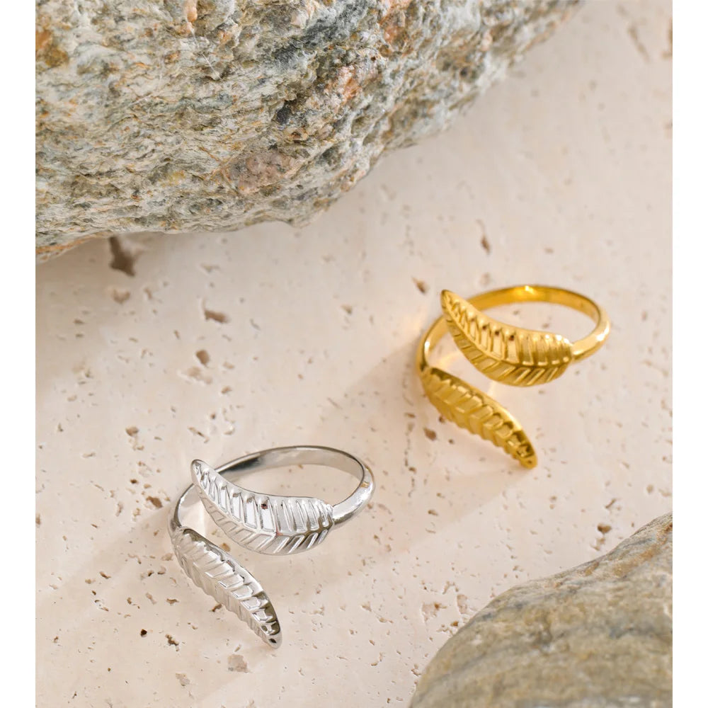 Gold and ring design featuring curved leaf shape