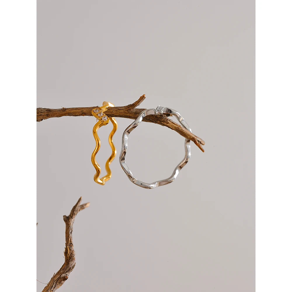 Elegant open band ring with row of cubic zirconia accents