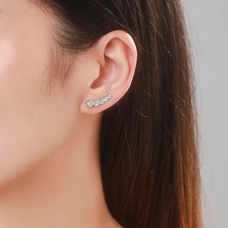 Close view of cz on silver stud earrings with sparkling wing detail