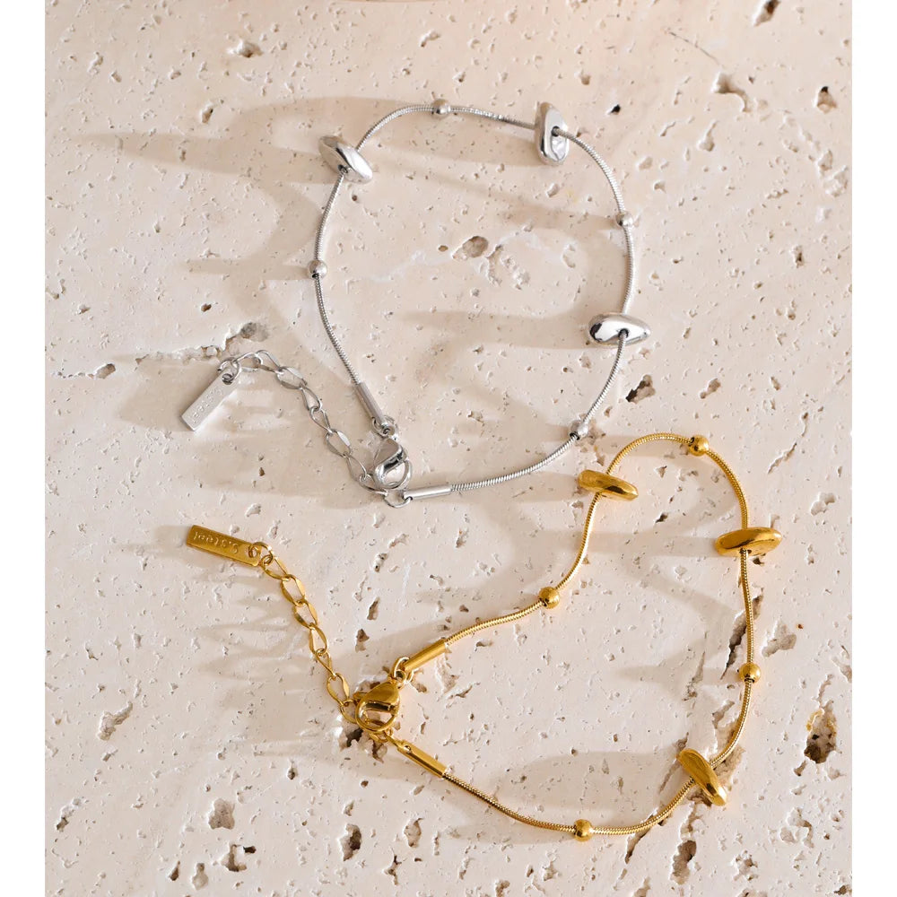 Women wearing gold jewelry chain necklace and bracelets accessory