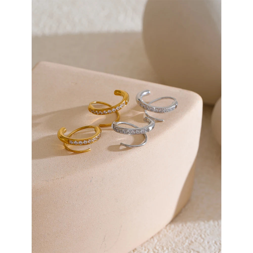 Delicate gold hoop earrings set with cubic zirconia stones