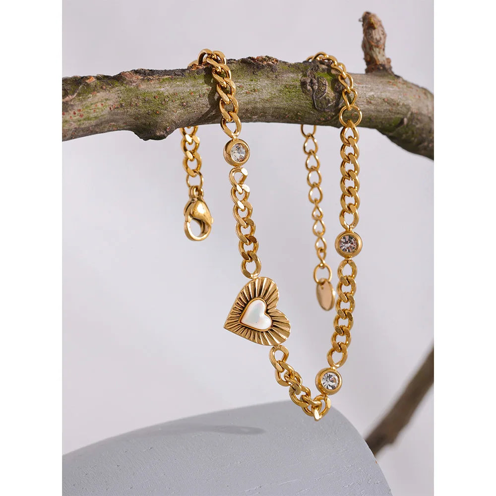 Delicate bracelet charm on a slim chain with gold plated shine