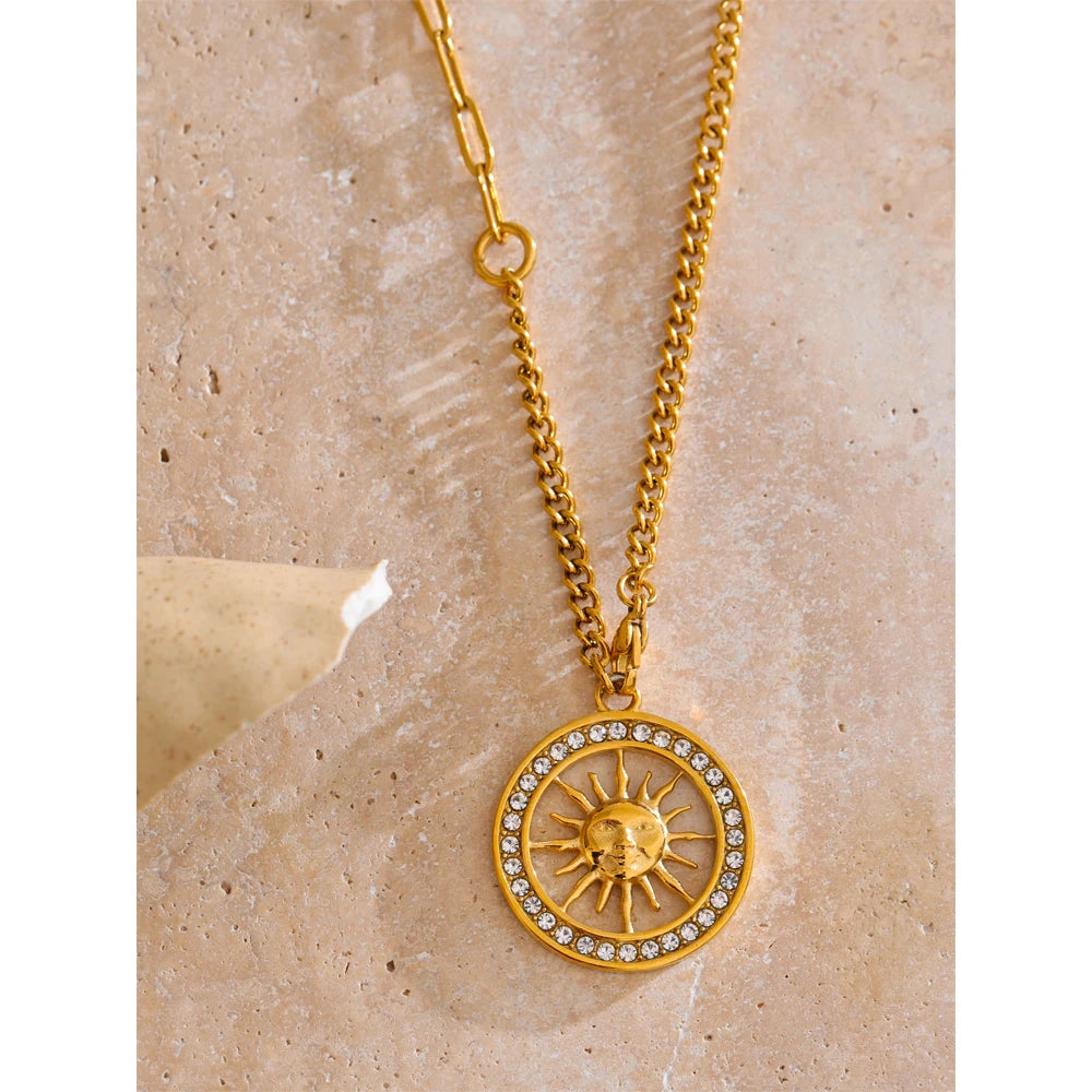 Close-up of pendant necklace showing cubic zirconia detail on sun hollow design