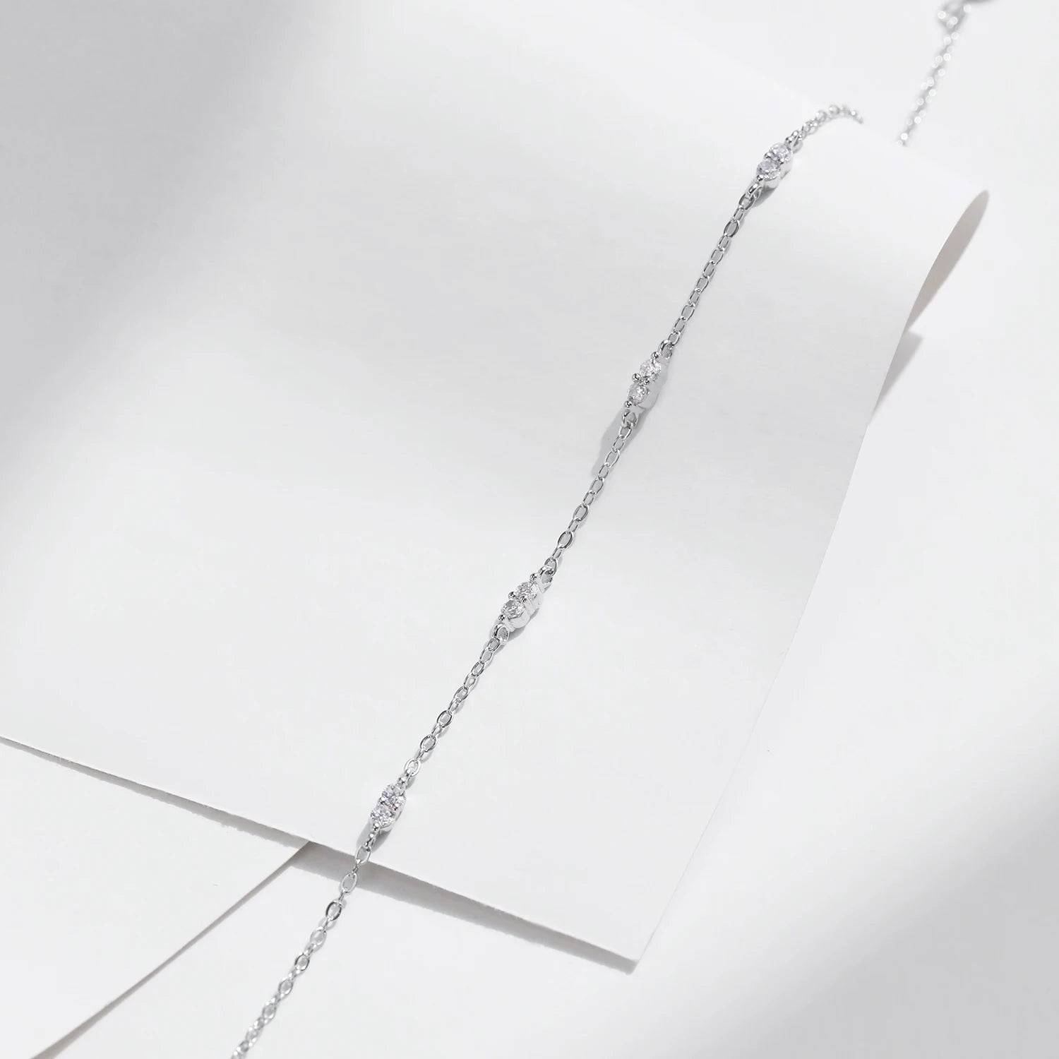 Silver bangle inspired bracelet in sterling silver with zirconia