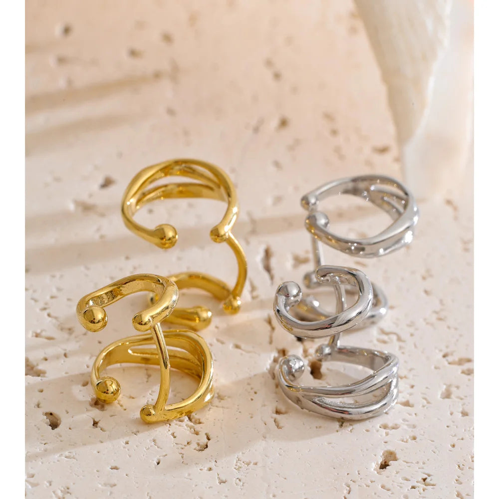 Close up of gold plated ear clip earrings for women and men