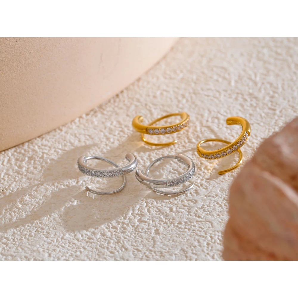 Close view of hoop earrings featuring cubic zirconia and earrings gold earrings glow