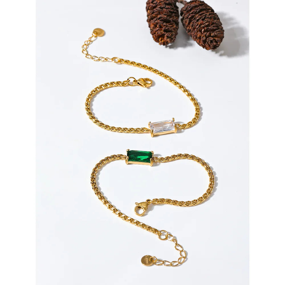 Elegant a gold bracelet paired with a matching gold chain