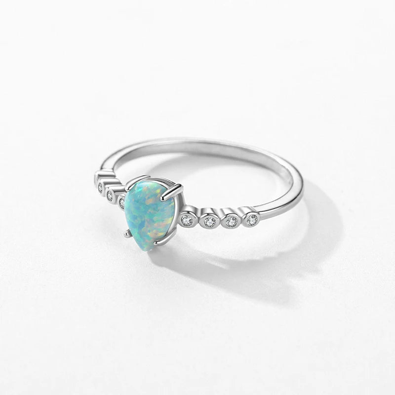 Sterling ring featuring opal stone on a polished silver band