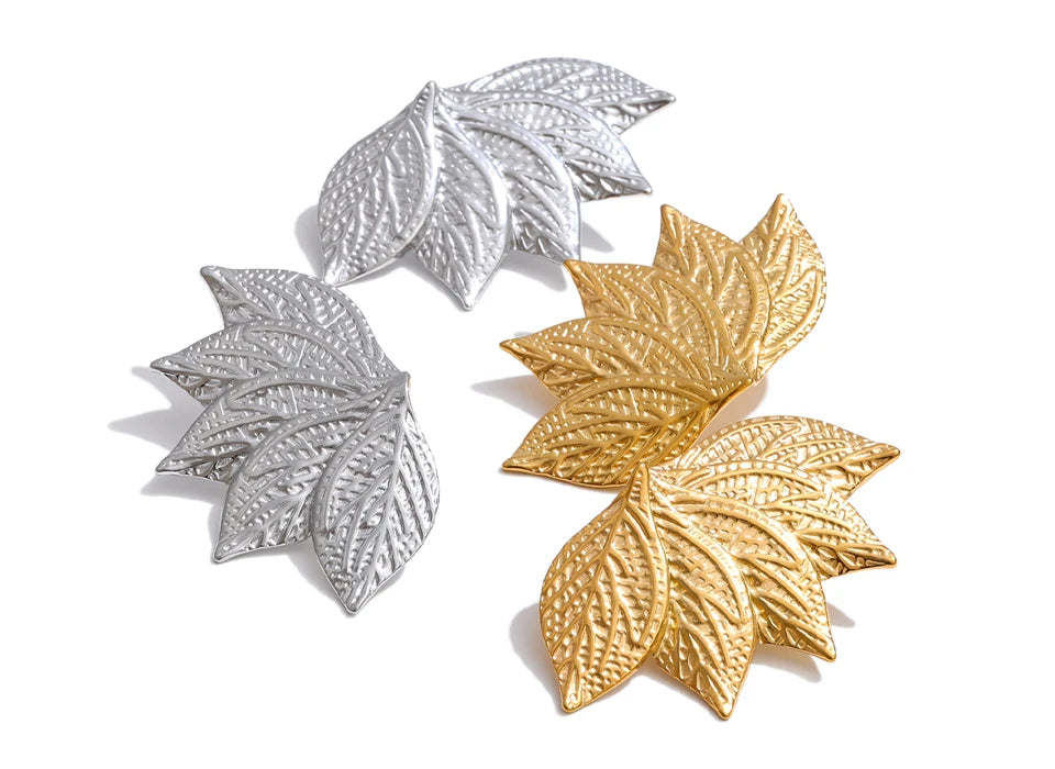 Polished gold plated stud earrings with natural leaf shape