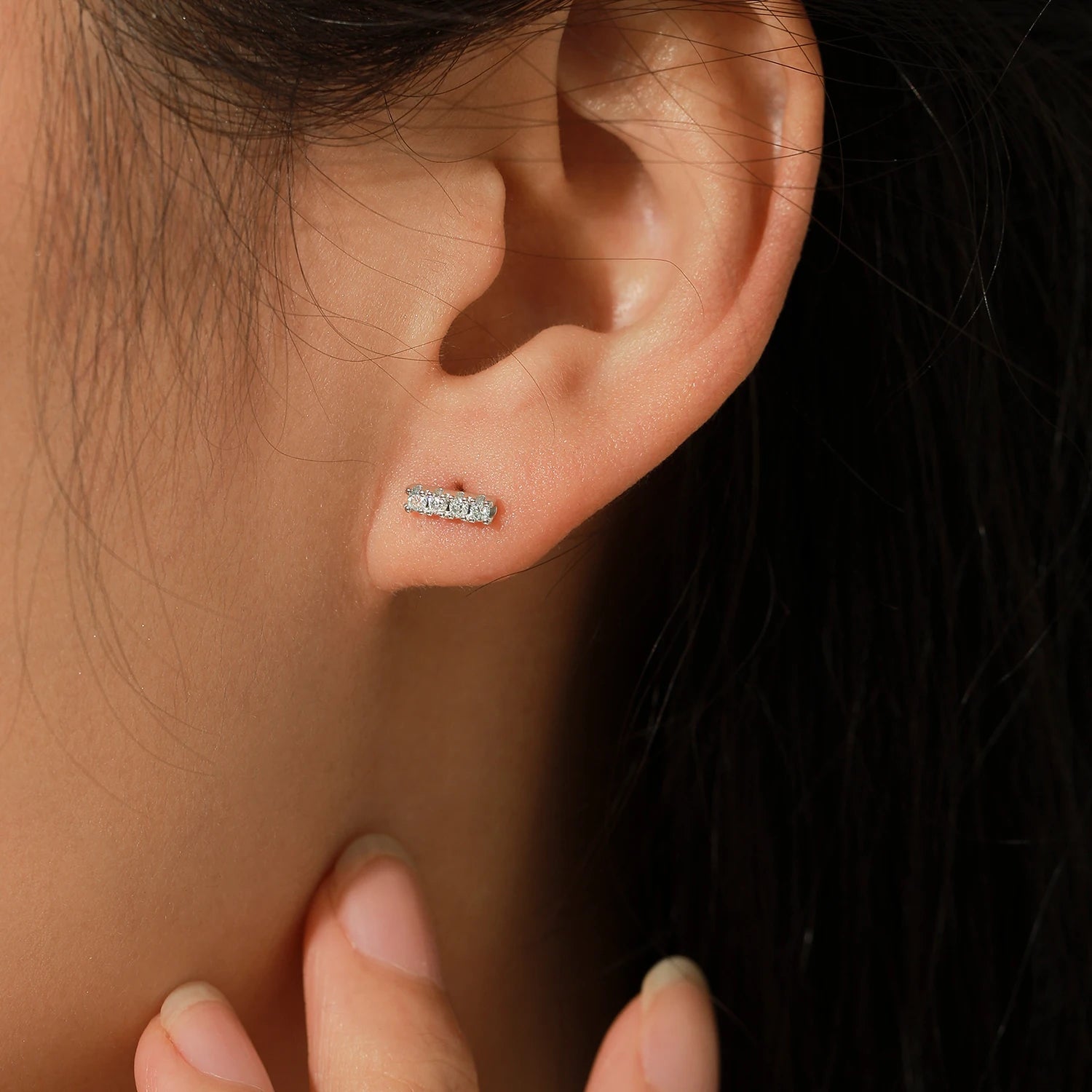 Silver earrings showing moissanite diamonds as classic diamond stud earrings