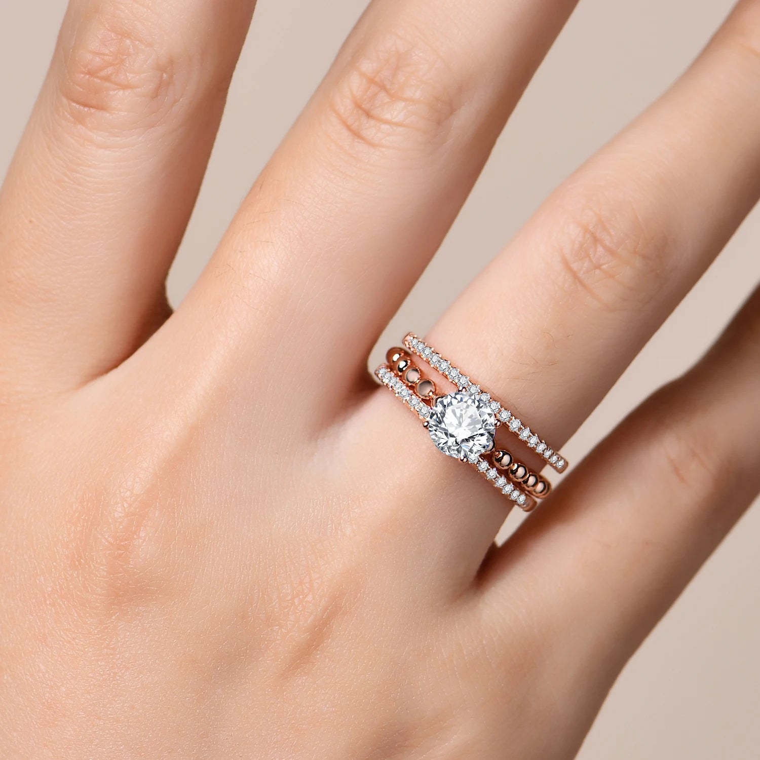 Engagement ring with moissanite presented with ring size from ring guide