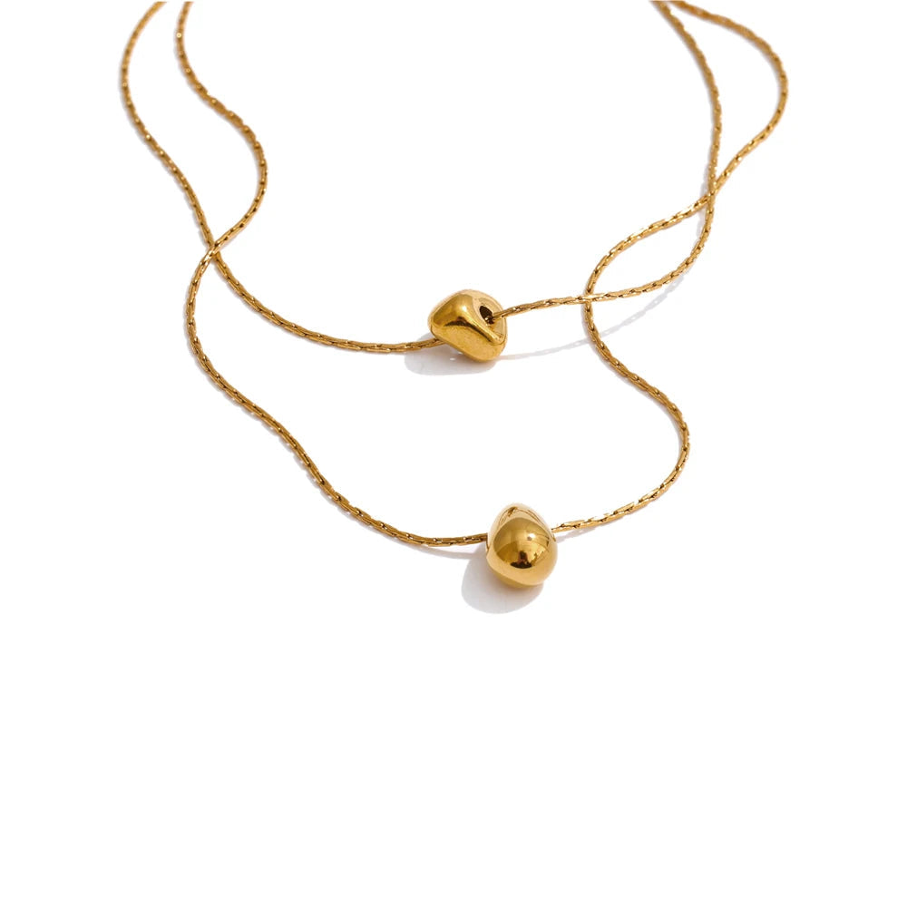 Double layer chain necklace with cast pendant in gold plated stainless steel jewelry