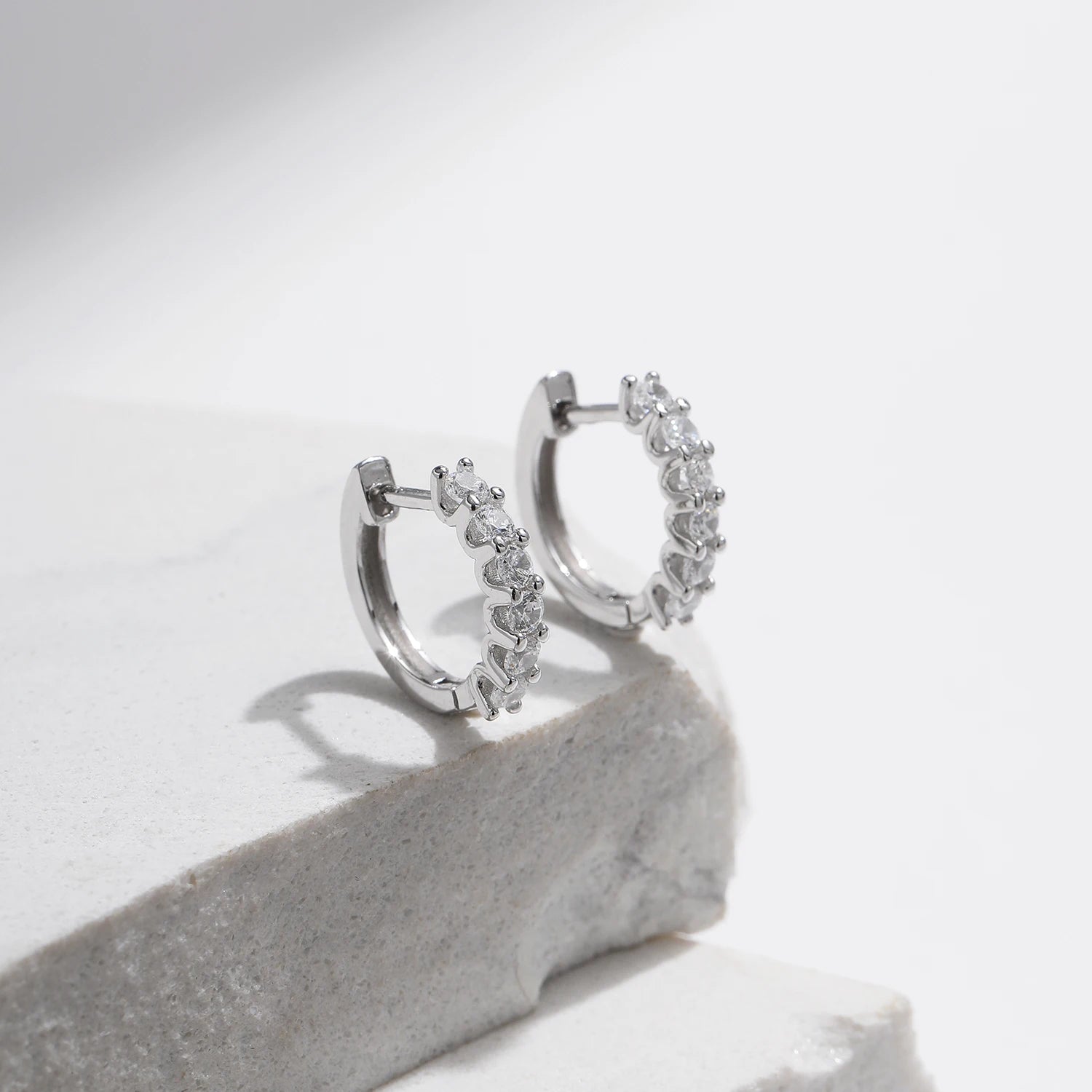 Small hoop earrings crafted in 925 silver with moissanite shine
