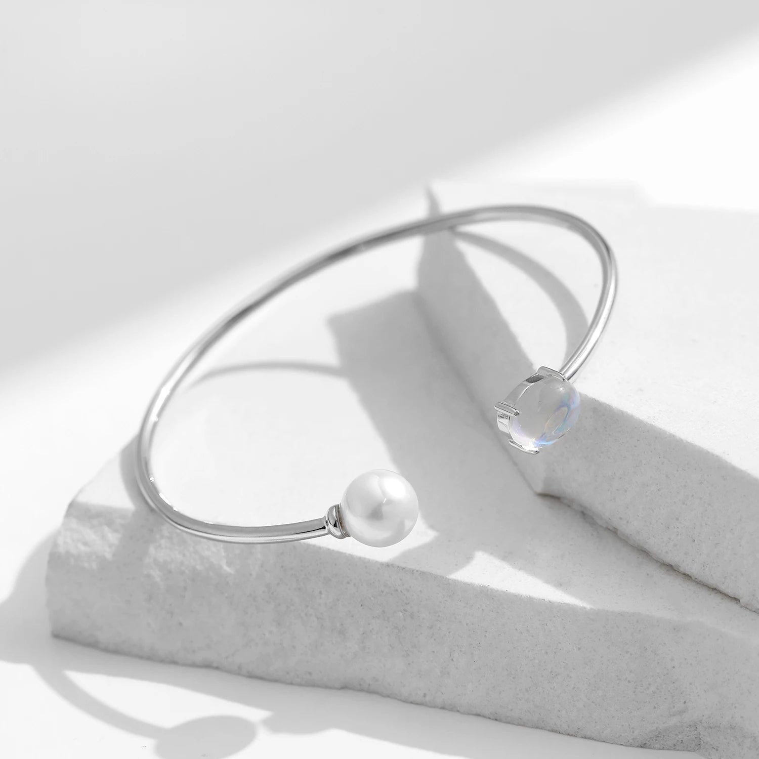 Silver bangle bracelet with crystal, pearl & moonstone detail